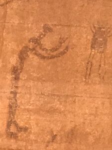 man and floating animal pictograph