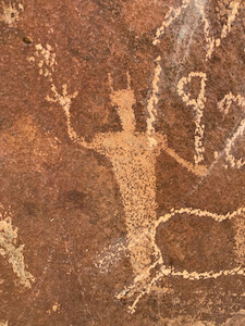 man catching star petroglyph