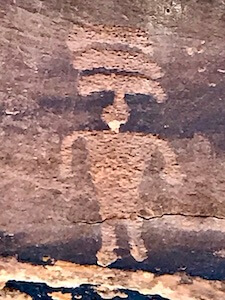 man with banded headdress petroglyph