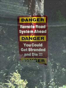 sign saying you could die driving this road
